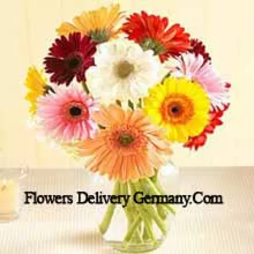 Assorted Colored Daisies In A Glass Vase