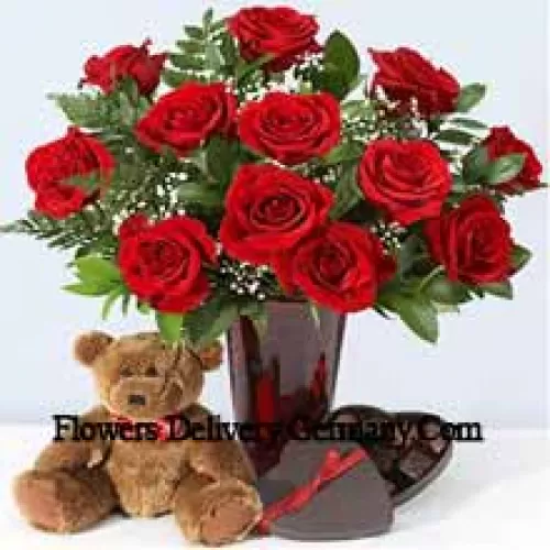 11 Red Roses With Some Ferns In A Vase, Cute Brown 10 Inches Teddy Bear And A Heart Shaped Chocolate Box.